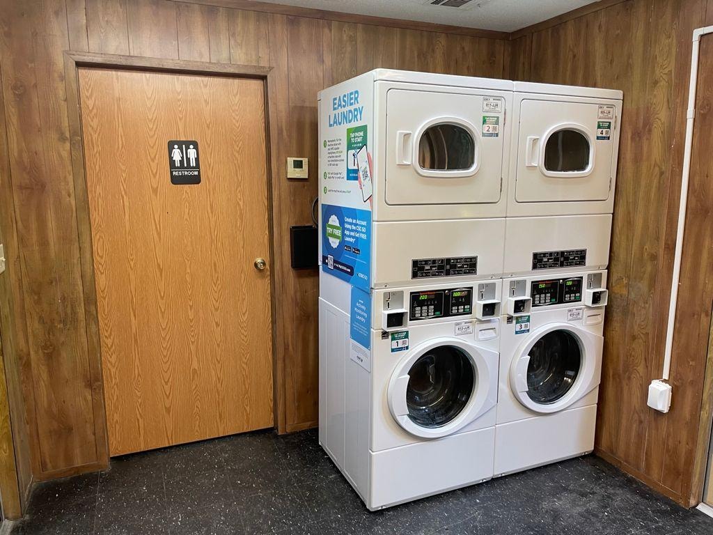 Laundry room with washers and dryers at Sugar Land RV Park